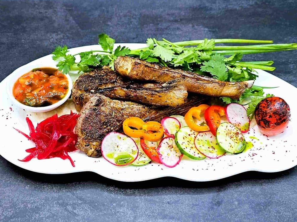 Rack of Australian lamb with salsa sauce and fresh herbs