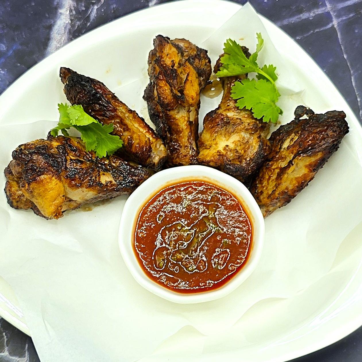 BBQ Chiken wings marinated in spicy adjika