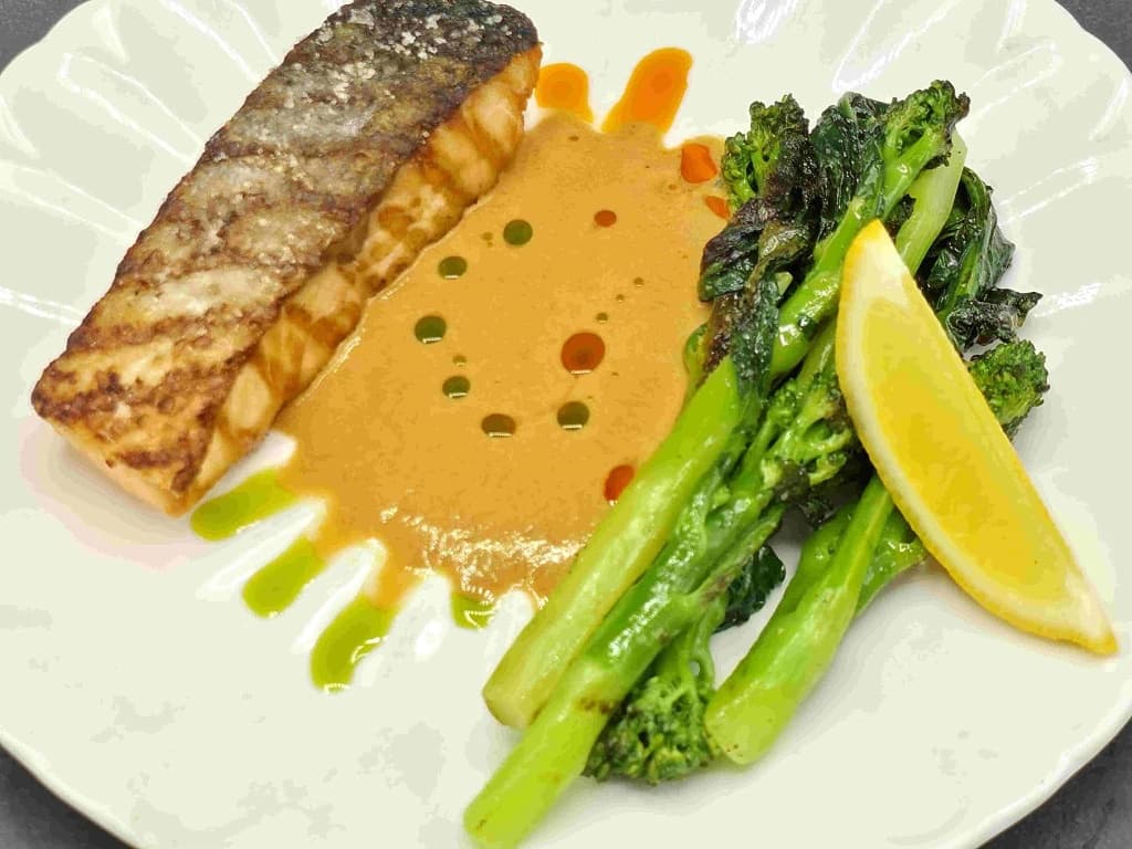 Salmon with mini kale and bisque sauce