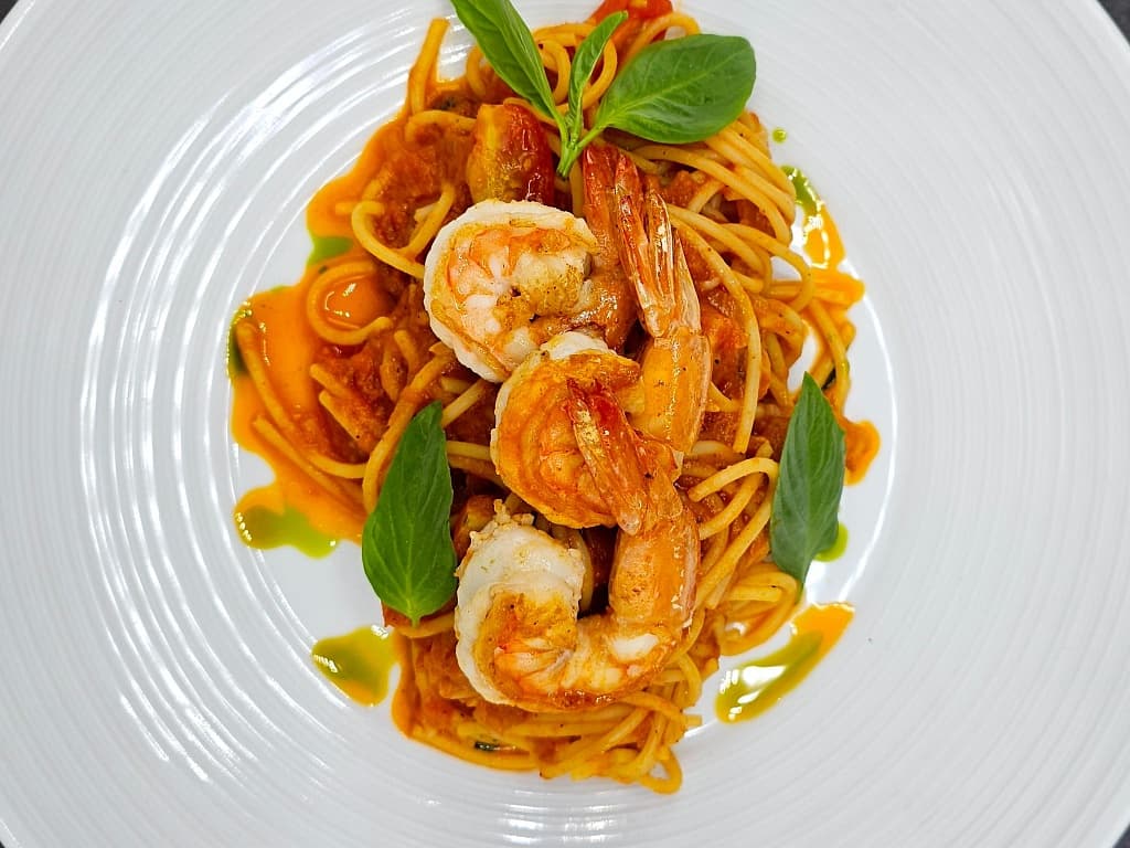 Spaghetti with shrimps in tomato sauce