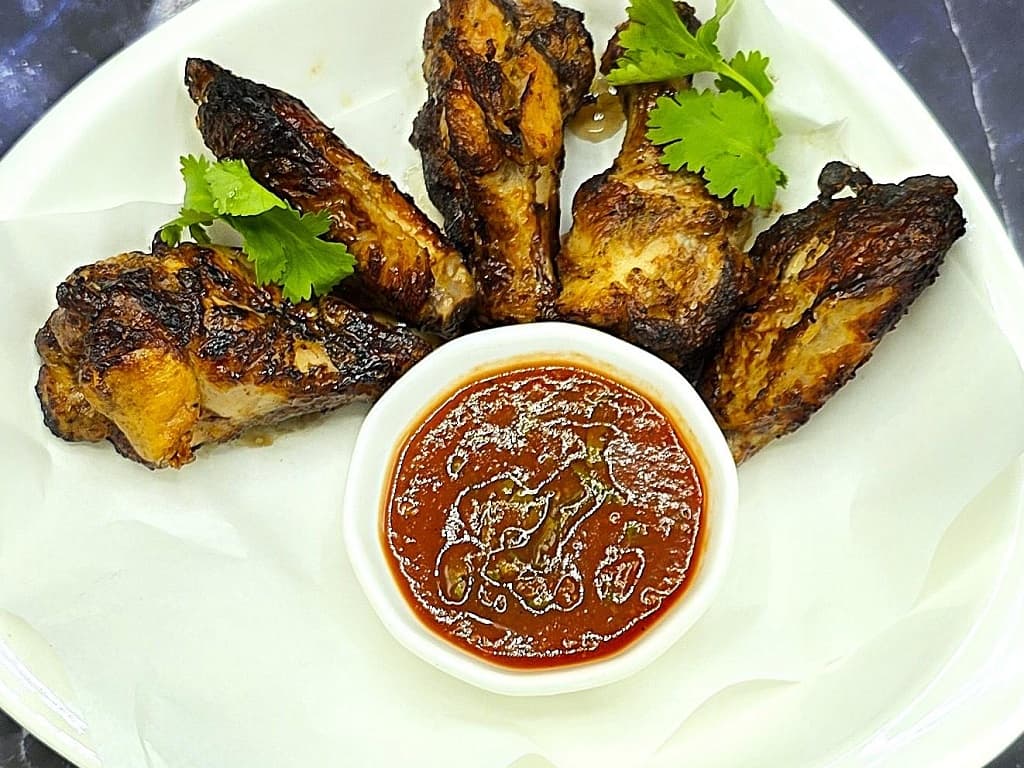 BBQ Chiken wings marinated in spicy adjika