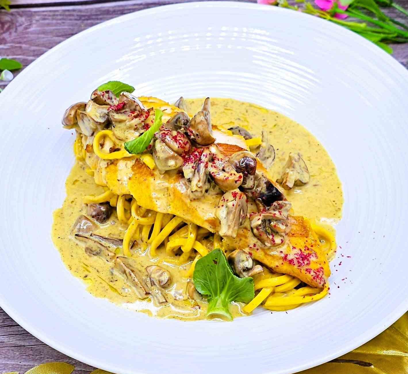 Pasta with chicken and mushrooms in a creamy sauce