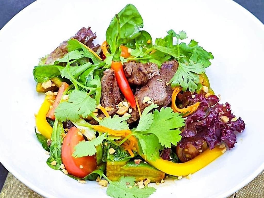 Veal, cucumber, tomato and carrot salad in Thai style