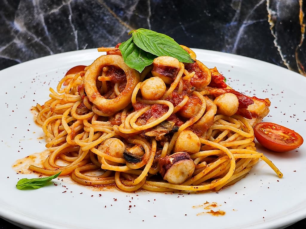 Spaghetti with seafood in tomato sauce