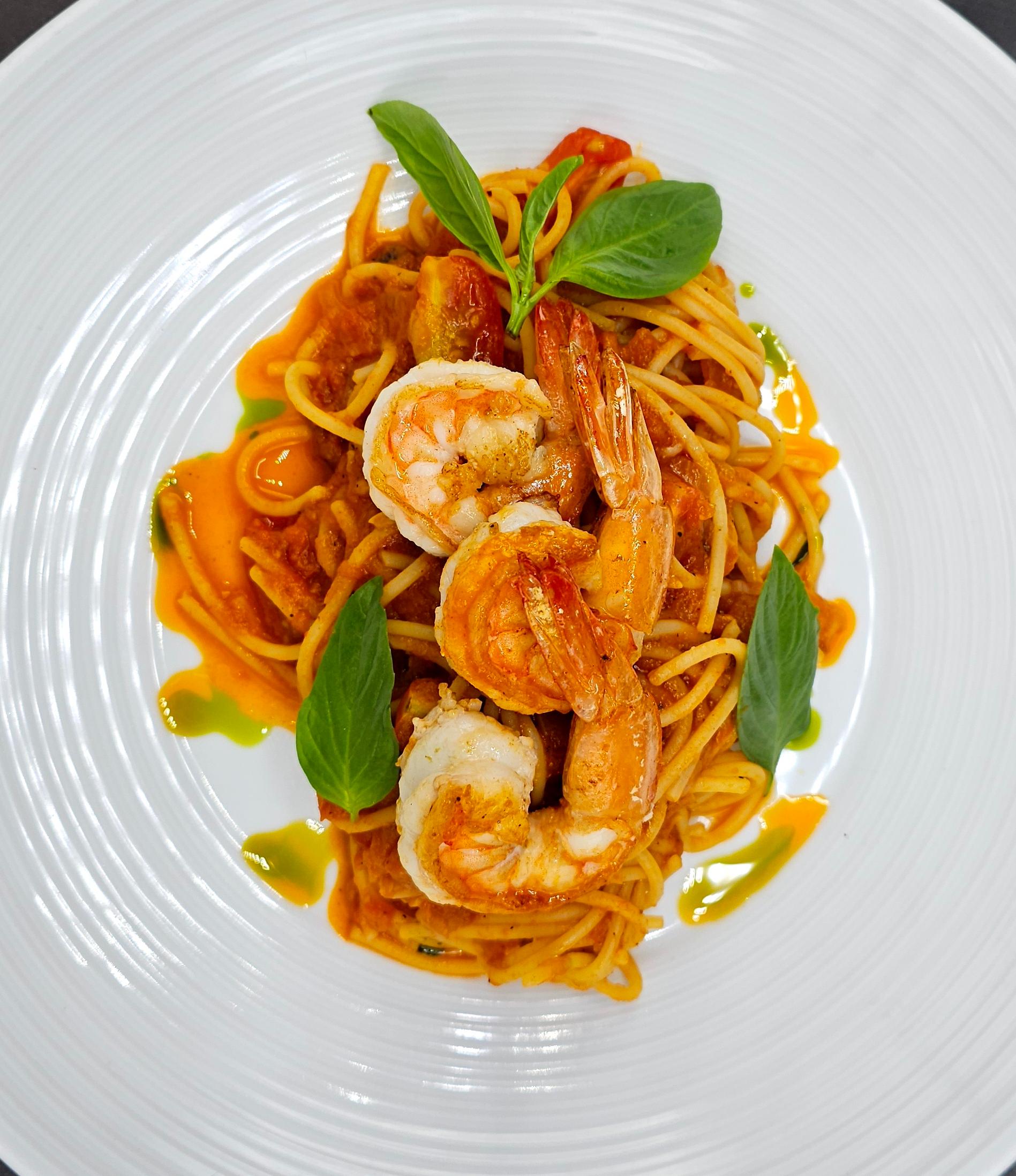 Spaghetti with shrimps in tomato sauce