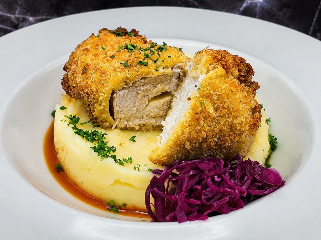 Fried chicken cutlet with cheese and mashed potatoes