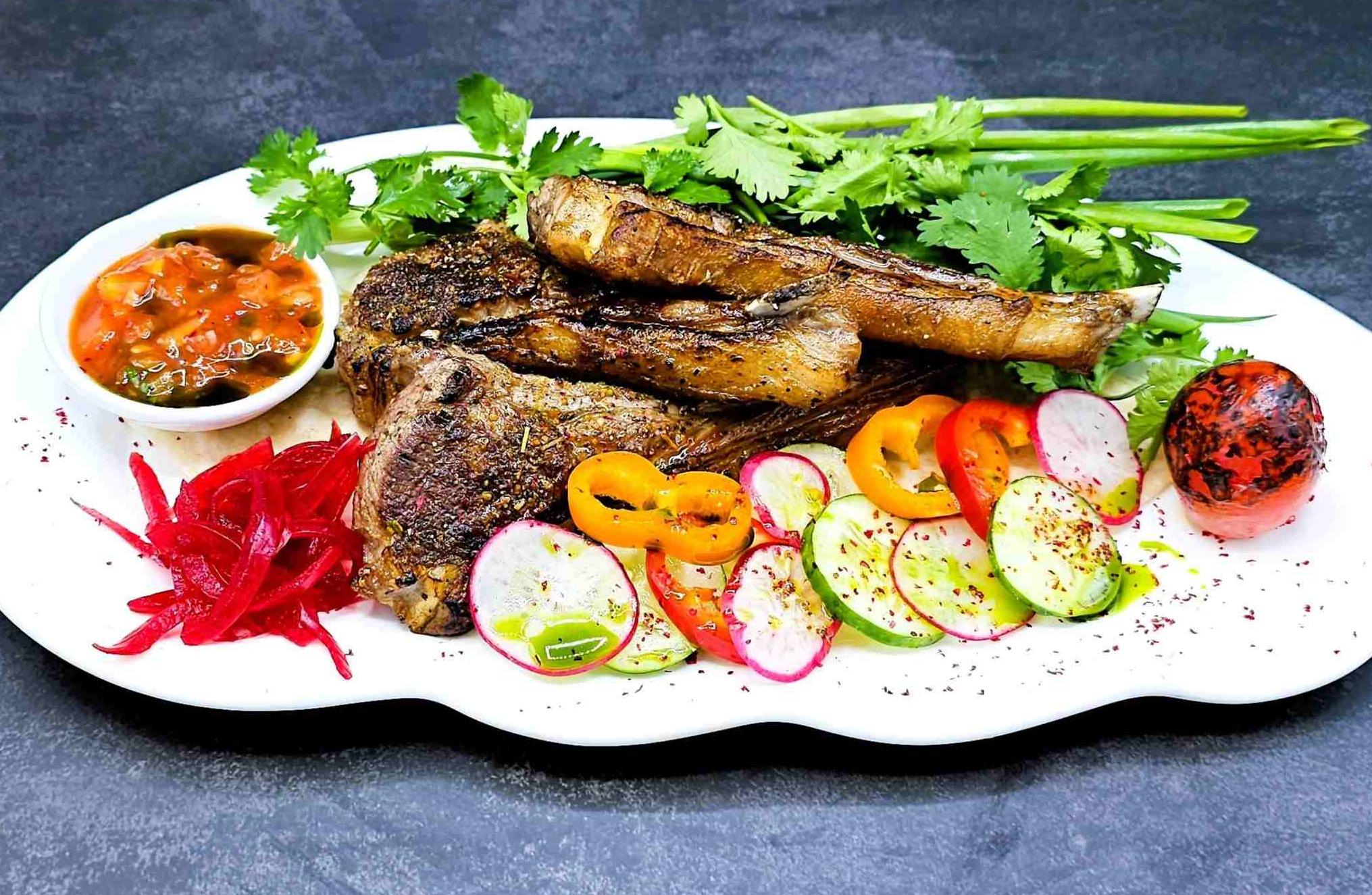 Rack of Australian lamb with salsa sauce and fresh herbs